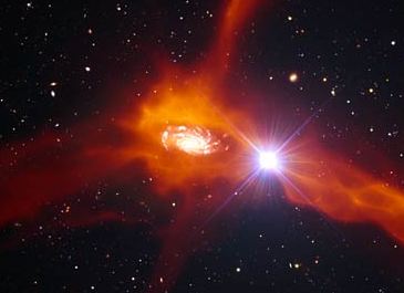 Ilustracin de una galaxia distante en el proceso de atraer gas fro (en colores anaranjados) de sus alrededores. Crdito: ESO.